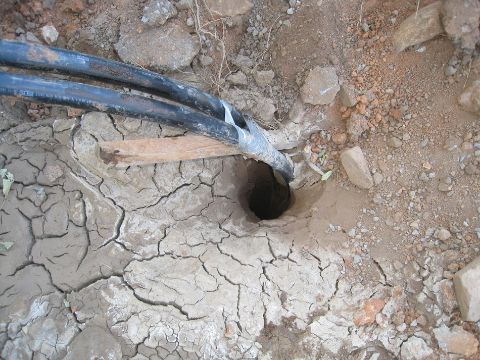 Geothermal/HVAC--Pipe sunk into well