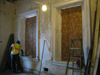 Second Floor--Priming window frames in southwest corner room - September 22, 2010