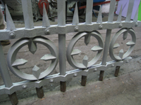 Fence - at G. Krug and Sons - detail of circles, bars, and spears after repair and priming.