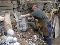 Fence -- Swiss Foundry -- extracting fence elements from cooling molds.