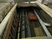 Ground Floor (Basement) - original brick chase for ventilation, located under the main corridor running east and west, now being used as a utility chase.