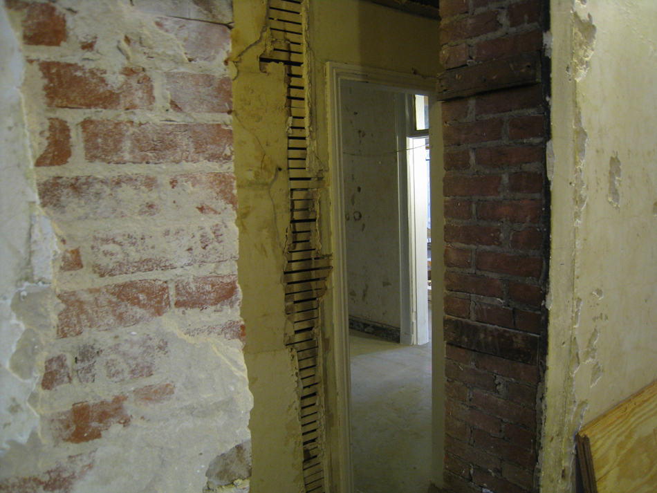 First Floor--From original staircase looking south east through wall to corridor