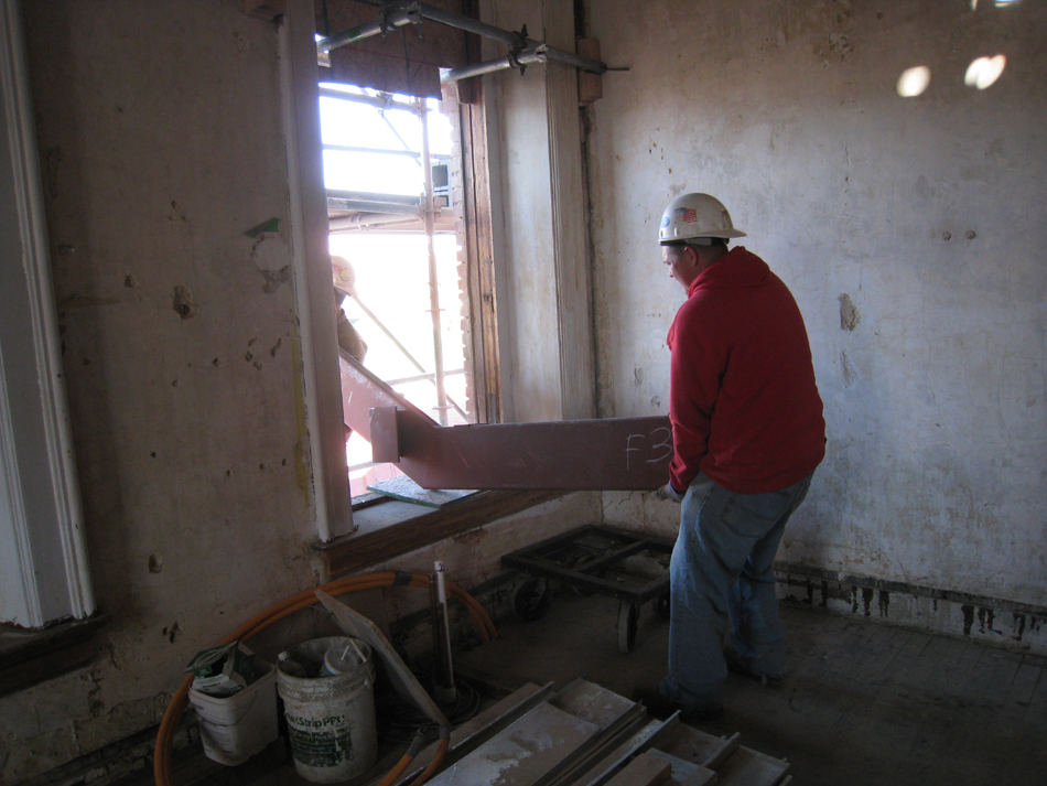 Second Floor--Lifting the parts for the east staircase into the building (through the west side corridor window)