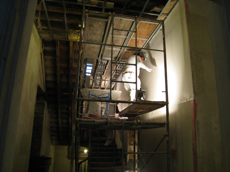 Second Floor--Central stairwell--Applying final plaster coat - January 7, 2011