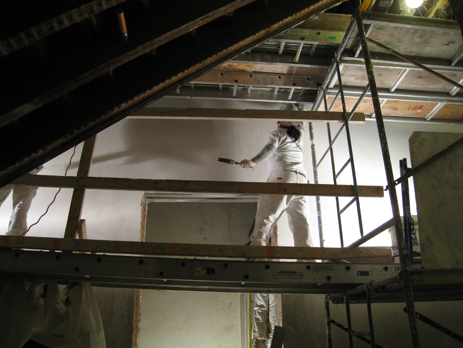 Second Floor--Applying final plaster coat in central stairwell - January 7, 2011