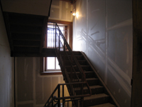 First floor--West stairwell with finished drywall - January 20, 2011