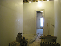 Second Floor--Looking south to large room from central stairwell.  Note floor sanding - January 20, 2011