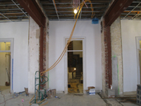 Second Floor--Large central room with large I-beams and finished plaster, looking north to central entrance - January 20, 2011