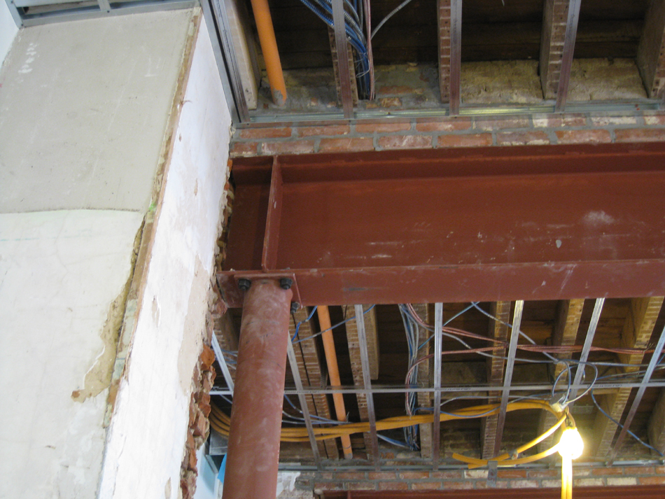Second Floor--Large central room with large I-beams and finished plaster--detail of column, beam and brickwork - January 20, 2011