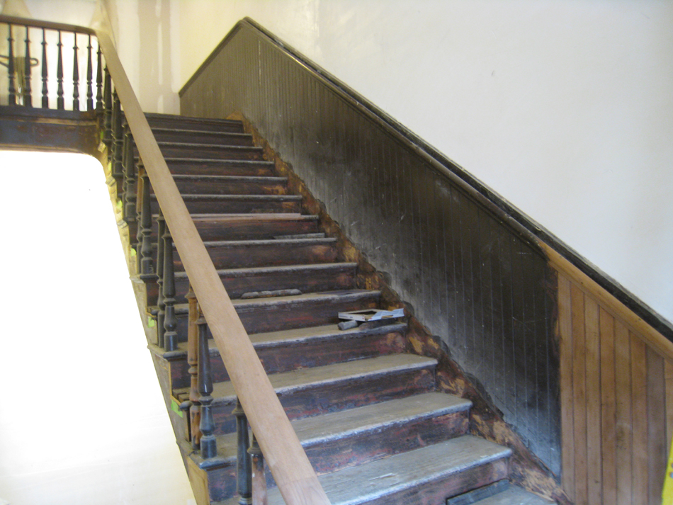 Third Floor--Sanded and unsanded railing for the central staircase (note the two alternating woods in the chair rail) - March 14, 2011