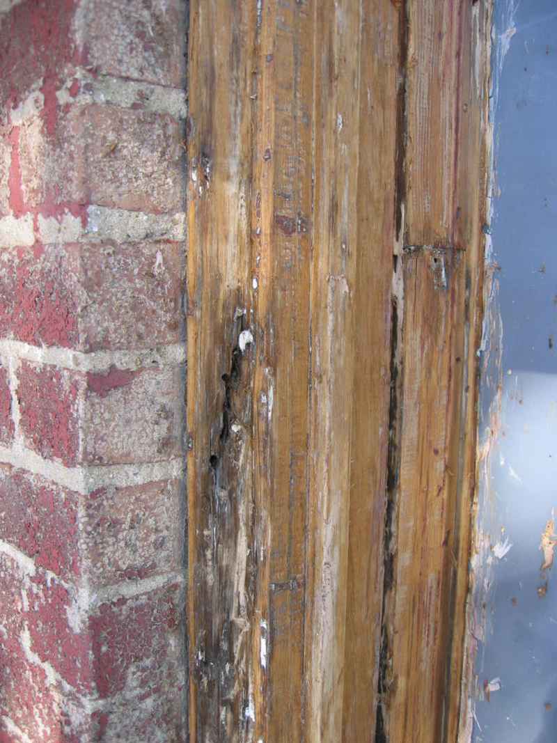 After the door was cleaned of paint though meticulous scraping, the door frame was found to have some significant damage to it with gouged out areas