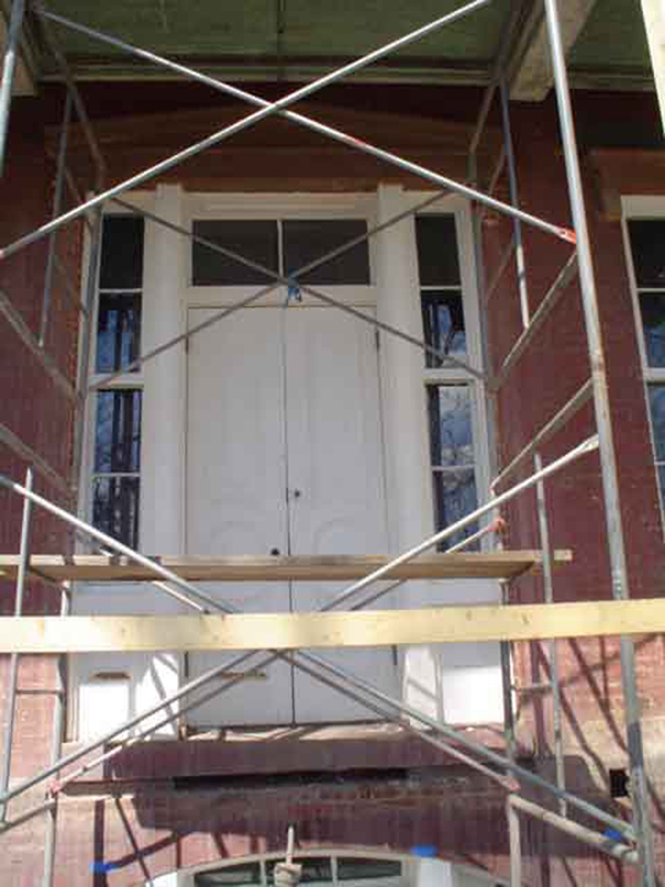 For both of the doors (main portico and basement on the south facade) the transom and  sidelites have been installed. They are both awaiting hardware for final installation.
