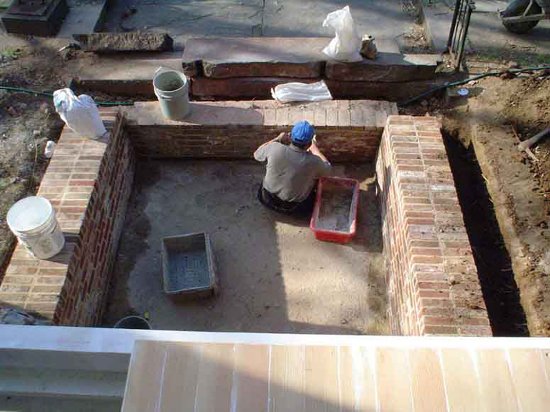The retaining wall ws excavated on each side and then repointed and relaid where necessary. 
The front of the wall was mostly relaid, as were the top layers on the sides.