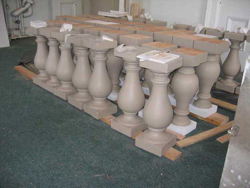 The final step in completing the construction of the portico is re-placing the balusters.